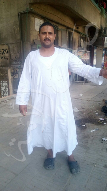 محمد بكار حارس عقار في شارع  الدقي