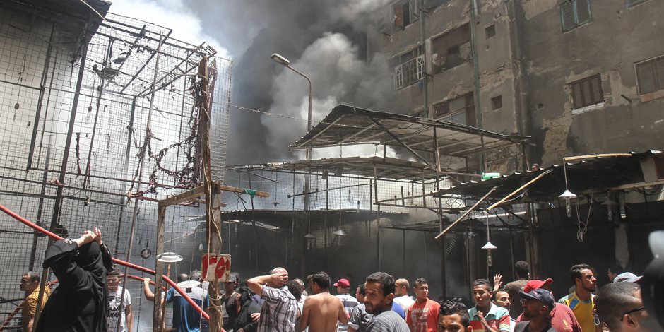 حريق هائل بسوق الملابس في إمبابة(صور)