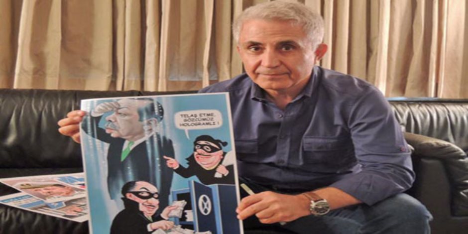 جائزة دولية لرسام كاريكاتور تركى أٌدين بالإرهاب من نظام أردوغان