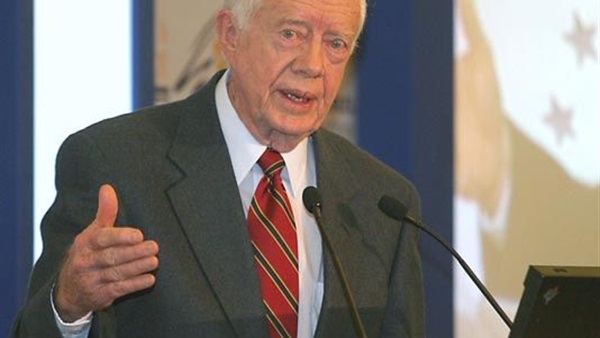 كارتر يدعو ألمانيا لحل أزمة اللاجئين 