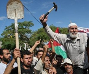 عمال فلسطين بين فكي سجن "التماسيح" وسماسرة التهريب.. صرخة نقابية لمنظمة العمل الدولية 