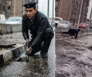 "تسلم الأيادي".. لقطة إنسانية لأمين شرطة يُسلك "بلاعة" لتصريف مياه الأمطار تتصدر التريند (فيديو)