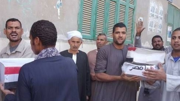 توزيع 1100 كرتونة مواد غذائية بنصف سعرها في أسيوط 