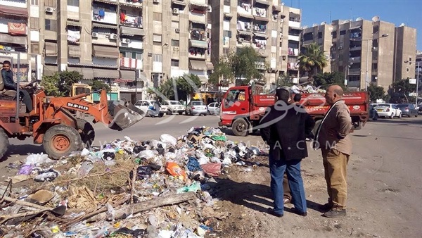 حملة للنظافة بشوارع بنك الاسكان في بورسعيد 